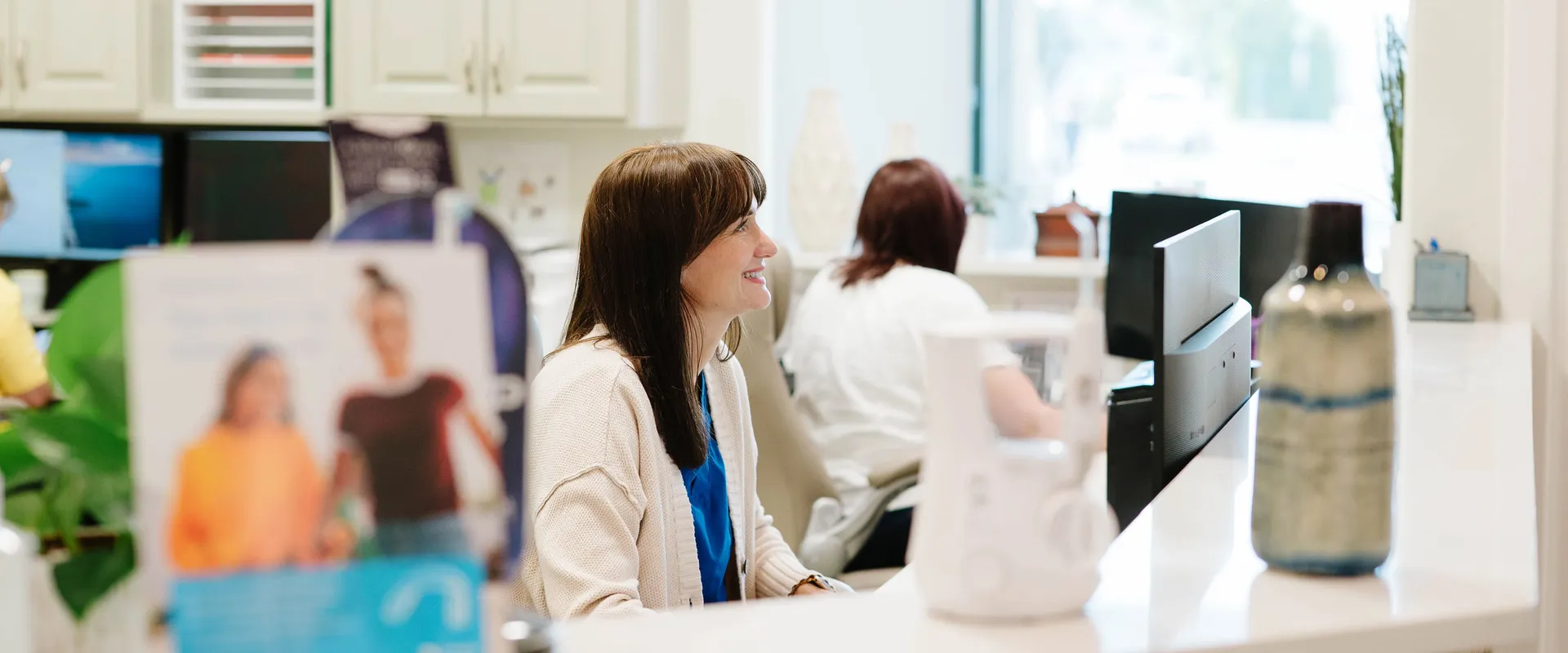 Friendly front desk team at CrossPointe Dental